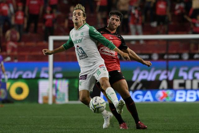Leon's midfielder #16 Jordi Cortizo and Tijuana's defender #33 Pablo Ortiz fight for the ball during the Liga MX Apertura football match between Tijuana and Leon at Caliente stadium in Tijuana, Mexico on July 24, 2026. (Photo by Guillermo Arias / AFP)
