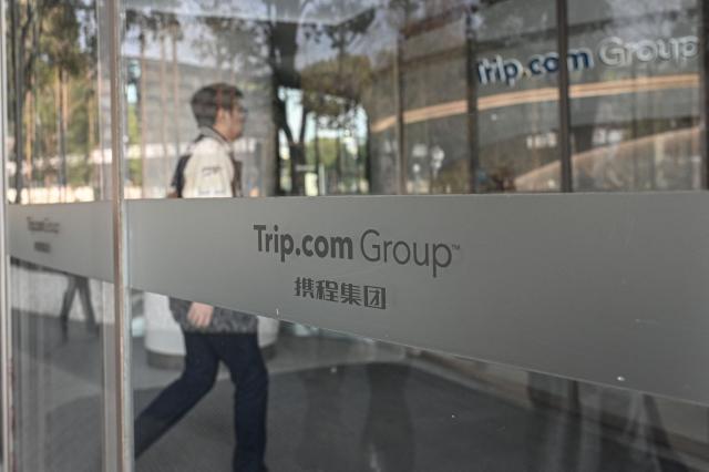(FILES) The logo of China's travel agency Trip.com Group is seen at its headquarter in Shanghai on January 15, 2026. China's market regulator said on July 25, 2026, it had fined and confiscated 765 million USD from the country's largest online travel provider Trip.com Group for violating monopoly laws. (Photo by Jade GAO / AFP)