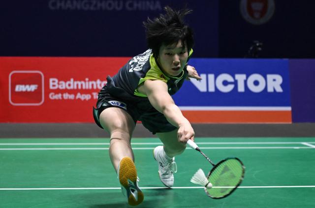 Japan's Akane Yamaguchi hits a return to China's Wang Zhiyi during their women's singles semifinal match at the China Open badminton tournament in Changzhou, eastern China's Jiangsu province on July 25, 2026. (Photo by CN-STR / AFP) / China OUT