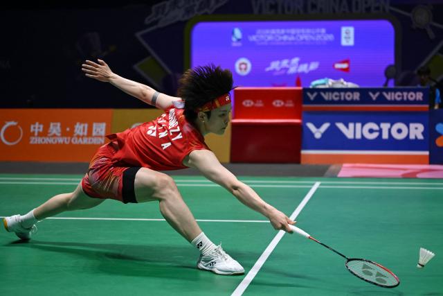 China's Wang Zhiyi hits a return to Japan's Akane Yamaguchi during their women's singles semifinal match at the China Open badminton tournament in Changzhou, eastern China's Jiangsu province on July 25, 2026. (Photo by CN-STR / AFP) / China OUT