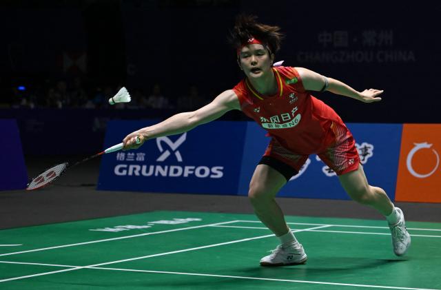 China's Wang Zhiyi hits a return to Japan's Akane Yamaguchi during their women's singles semifinal match at the China Open badminton tournament in Changzhou, eastern China's Jiangsu province on July 25, 2026. (Photo by CN-STR / AFP) / China OUT