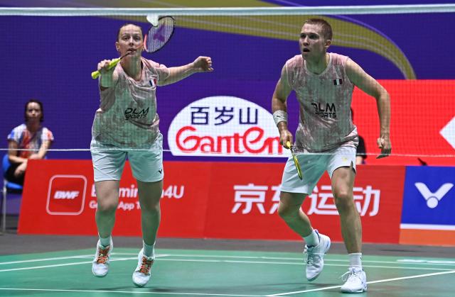 France's Thom Gicquel and Delphine Delrue play against China's Feng Yan Zhe and Huang Dongping during their mixed doubles semifinal match at the China Open badminton tournament in Changzhou, eastern China's Jiangsu province on July 25, 2026. (Photo by CN-STR / AFP) / China OUT