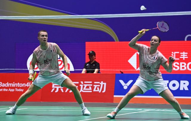 France's Thom Gicquel and Delphine Delrue play against China's Feng Yan Zhe and Huang Dongping during their mixed doubles semifinal match at the China Open badminton tournament in Changzhou, eastern China's Jiangsu province on July 25, 2026. (Photo by CN-STR / AFP) / China OUT