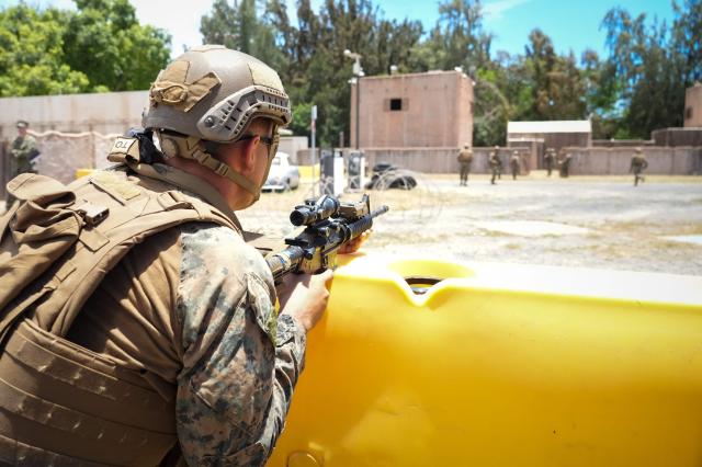 A US Marine provides security during a simulated amphibious assault and non-combatant evacuation operation (NEO) during Exercise Rim of the Pacific (RIMPAC) 2026 at Marine Corps Training Area Bellows, Hawaii, on July 24, 2026. (Photo by Michelle Bir / AFP)