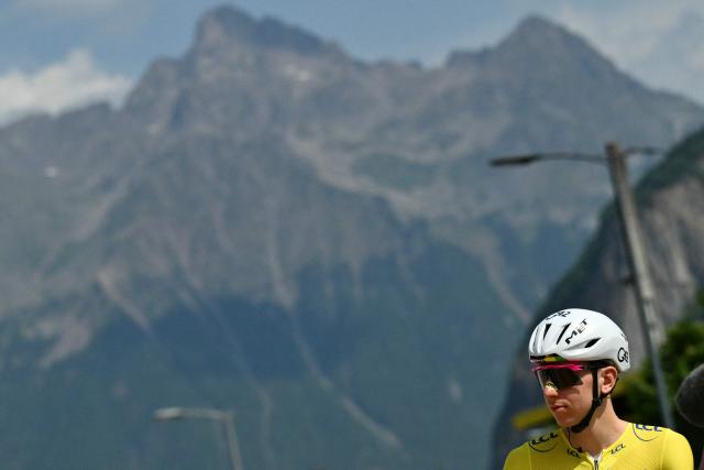 UAE Team Emirates - XRG's Slovenian rider Tadej Pogacar wearing the overall leader's yellow jersey awaits the start of the 20th stage of the 113th edition of the Tour de France cycling race, 170,9 km between Le Bourg-d'Oisans and Alpe d'Huez in the French Alps, on July 25, 2026. (Photo by Jeff PACHOUD / AFP)