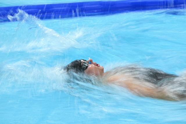 Canada's Kylie Masse competes in the Women's 100m Backstroke heats during the swimming event at the Tollcross International Swimming Centre in Glasgow, on day two of the Commonwealth Games in Glasgow, Scotland, on July 25, 2026. (Photo by Oli SCARFF / AFP)