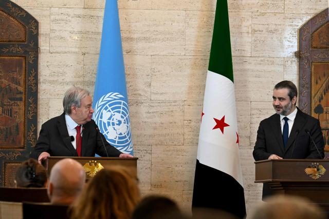UN Secretary-General Antonio Guterres (L) and Syria's Foreign Affairs Minister Asaad al-Shaibani hold a joint press conference following their meeting at the Tishreen Palace in the Syrian capital Damascus on July 25, 2026. United Nations Secretary-General Antonio Guterres urged international support for Syria on July 25, as he visited the country, which is in transition following years of war and the overthrow of longtime ruler Bashar al-Assad. Guterres is the first UN chief to visit Syria since his predecessor Ban Ki-moon in 2009, two years before the start of Syria's civil war which went on to kill more than half a million people before the new Islamist authorities took power in December 2024. (Photo by LOUAI BESHARA / AFP)