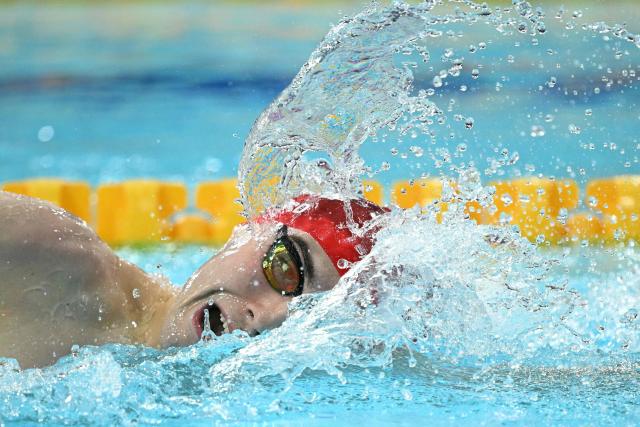 England's William Ellard swims to break the games record in the Men's 200m S14 Freestyle heats during the swimming event at the Tollcross International Swimming Centre in Glasgow, on day two of the Commonwealth Games in Glasgow, Scotland, on July 25, 2026. (Photo by Oli SCARFF / AFP)