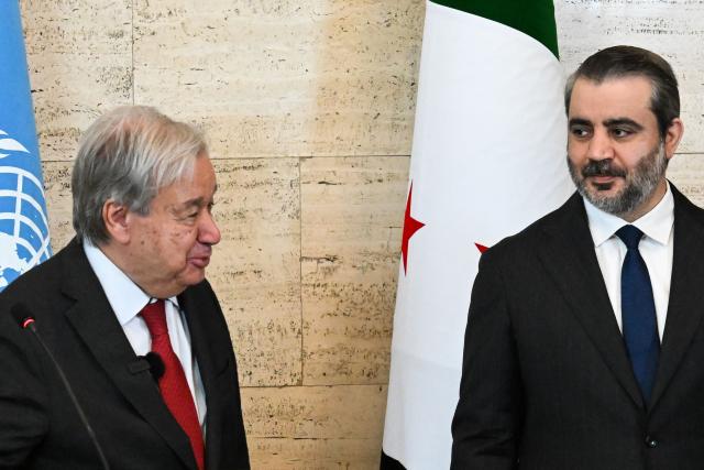 UN Secretary-General Antonio Guterres (L) and Syria's Foreign Affairs Minister Asaad al-Shaibani hold a joint press conference following their meeting at the Tishreen Palace in the Syrian capital Damascus on July 25, 2026. United Nations Secretary-General Antonio Guterres urged international support for Syria on July 25, as he visited the country, which is in transition following years of war and the overthrow of longtime ruler Bashar al-Assad. Guterres is the first UN chief to visit Syria since his predecessor Ban Ki-moon in 2009, two years before the start of Syria's civil war which went on to kill more than half a million people before the new Islamist authorities took power in December 2024. (Photo by LOUAI BESHARA / AFP)