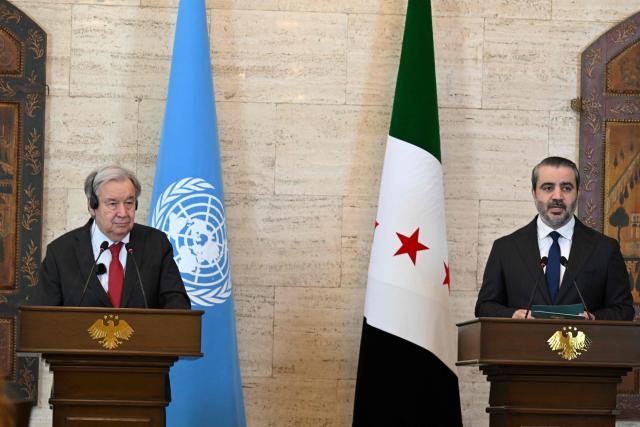 UN Secretary-General Antonio Guterres (L) and Syria's Foreign Affairs Minister Asaad al-Shaibani hold a joint press conference following their meeting at the Tishreen Palace in the Syrian capital Damascus on July 25, 2026. United Nations Secretary-General Antonio Guterres urged international support for Syria on July 25, as he visited the country, which is in transition following years of war and the overthrow of longtime ruler Bashar al-Assad. Guterres is the first UN chief to visit Syria since his predecessor Ban Ki-moon in 2009, two years before the start of Syria's civil war which went on to kill more than half a million people before the new Islamist authorities took power in December 2024. (Photo by LOUAI BESHARA / AFP)