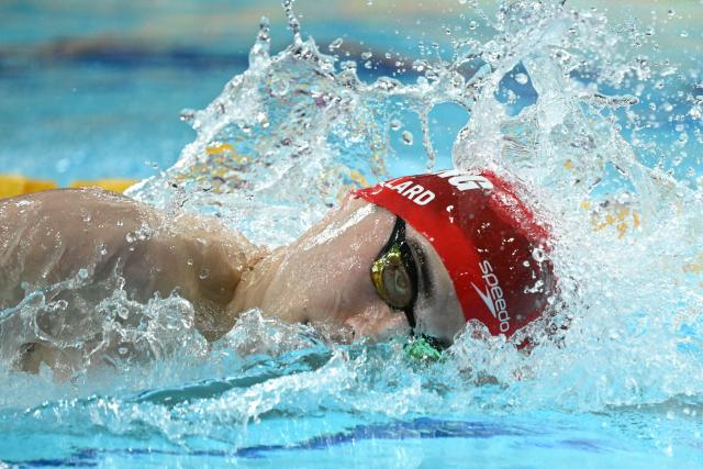 England's William Ellard swims to break the games record in the Men's 200m S14 Freestyle heats during the swimming event at the Tollcross International Swimming Centre in Glasgow, on day two of the Commonwealth Games in Glasgow, Scotland, on July 25, 2026. (Photo by Oli SCARFF / AFP)