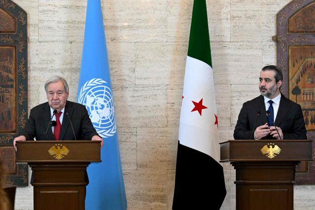 UN Secretary-General Antonio Guterres (L) and Syria's Foreign Affairs Minister Asaad al-Shaibani hold a joint press conference following their meeting at the Tishreen Palace in the Syrian capital Damascus on July 25, 2026. United Nations Secretary-General Antonio Guterres urged international support for Syria on July 25, as he visited the country, which is in transition following years of war and the overthrow of longtime ruler Bashar al-Assad. Guterres is the first UN chief to visit Syria since his predecessor Ban Ki-moon in 2009, two years before the start of Syria's civil war which went on to kill more than half a million people before the new Islamist authorities took power in December 2024. (Photo by LOUAI BESHARA / AFP)