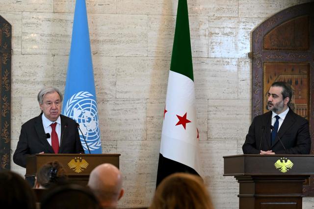 UN Secretary-General Antonio Guterres (L) and Syria's Foreign Affairs Minister Asaad al-Shaibani hold a joint press conference following their meeting at the Tishreen Palace in the Syrian capital Damascus on July 25, 2026. United Nations Secretary-General Antonio Guterres urged international support for Syria on July 25, as he visited the country, which is in transition following years of war and the overthrow of longtime ruler Bashar al-Assad. Guterres is the first UN chief to visit Syria since his predecessor Ban Ki-moon in 2009, two years before the start of Syria's civil war which went on to kill more than half a million people before the new Islamist authorities took power in December 2024. (Photo by LOUAI BESHARA / AFP)