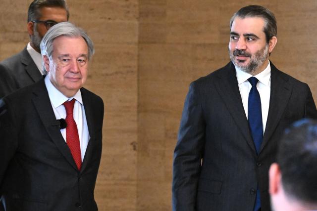 UN Secretary-General Antonio Guterres (L) and Syria's Foreign Affairs Minister Asaad al-Shaibani arrive for a joint press conference following their meeting at the Tishreen Palace in the Syrian capital Damascus on July 25, 2026. United Nations Secretary-General Antonio Guterres urged international support for Syria on July 25, as he visited the country, which is in transition following years of war and the overthrow of longtime ruler Bashar al-Assad. Guterres is the first UN chief to visit Syria since his predecessor Ban Ki-moon in 2009, two years before the start of Syria's civil war which went on to kill more than half a million people before the new Islamist authorities took power in December 2024. (Photo by LOUAI BESHARA / AFP)