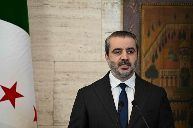 Syria's Foreign Affairs Minister Asaad al-Shaibani speaks as UN Secretary-General (unseen) listen on, during a joint press conference following their meeting at the Tishreen Palace in the Syrian capital Damascus on July 25, 2026. United Nations Secretary-General Antonio Guterres urged international support for Syria on July 25, as he visited the country, which is in transition following years of war and the overthrow of longtime ruler Bashar al-Assad. Guterres is the first UN chief to visit Syria since his predecessor Ban Ki-moon in 2009, two years before the start of Syria's civil war which went on to kill more than half a million people before the new Islamist authorities took power in December 2024. (Photo by LOUAI BESHARA / AFP)