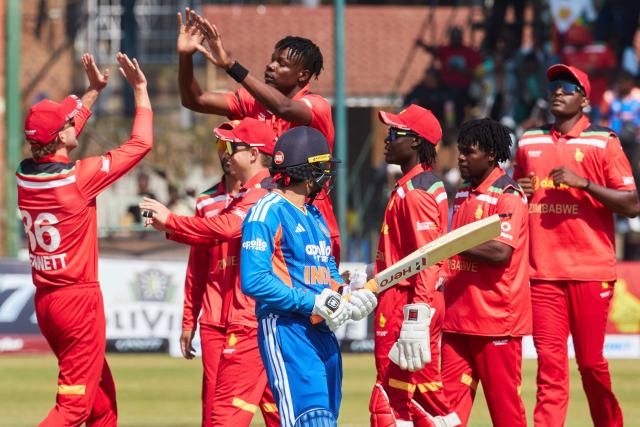 Zimbabwean players celebrate the wicket of Abishek Sharma during the second Twenty20 international cricket match between Zimbabwe and India at Harare Sports Club in Harare, on July 25, 2026. (Photo by Jekesai NJIKIZANA / AFP)
