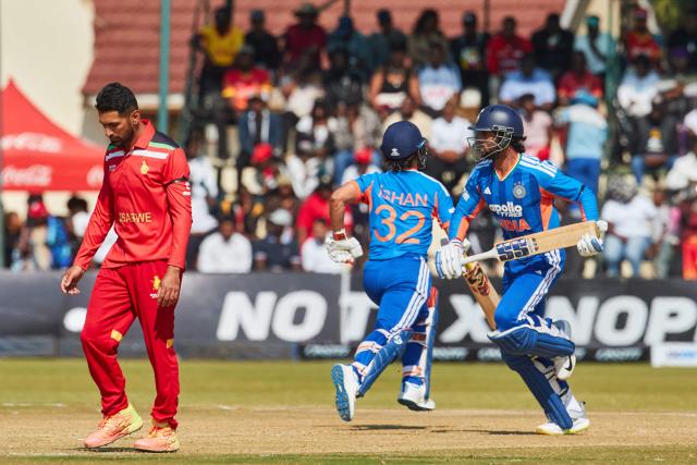 India's Tilak Varma (R) runs between the wickets during the second Twenty20 international cricket match between Zimbabwe and India at Harare Sports Club in Harare, on July 25, 2026. (Photo by Jekesai NJIKIZANA / AFP)