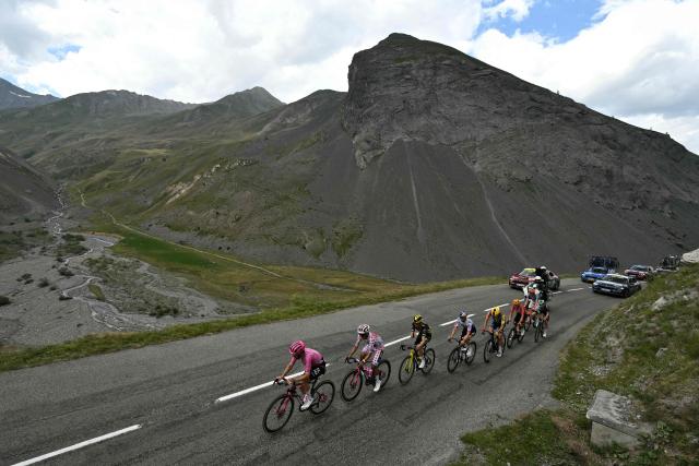 TOPSHOT - EF Education - EasyPost team's Irish rider Ben Healy (L) and EF Education - EasyPost team's Ecuadorian rider Richard Carapaz wearing the climber's dotted "King of the Mountains" jersey lead a breakaway in the Col du Galibier ascent during the 20th stage of the 113th edition of the Tour de France cycling race, 170,9 km between Le Bourg-d'Oisans and Alpe d'Huez in the French Alps, on July 25, 2026. (Photo by Jeff PACHOUD / AFP)