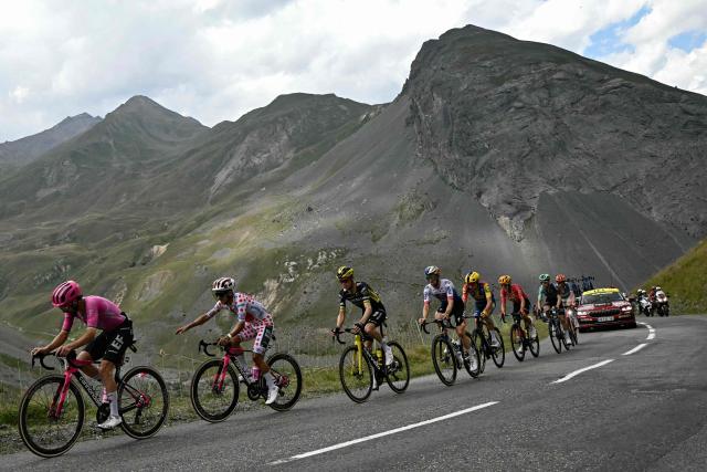 EF Education - EasyPost team's Irish rider Ben Healy (L) and EF Education - EasyPost team's Ecuadorian rider Richard Carapaz wearing the climber's dotted "King of the Mountains" jersey lead a breakaway in the Col du Galibier ascent during the 20th stage of the 113th edition of the Tour de France cycling race, 170,9 km between Le Bourg-d'Oisans and Alpe d'Huez in the French Alps, on July 25, 2026. (Photo by Loic VENANCE / AFP)