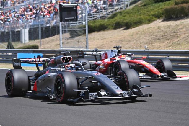 Audi's German driver Nico Hulkenberg and Ferrari's Monegasque driver Charles Leclerc drive during the third practice session at the Hungaroring racetrack in Mogyorod near Budapest, Hungary, on July 25, 2026 ahead of the Formula One Hungarian Grand Prix. (Photo by Attila KISBENEDEK / AFP)