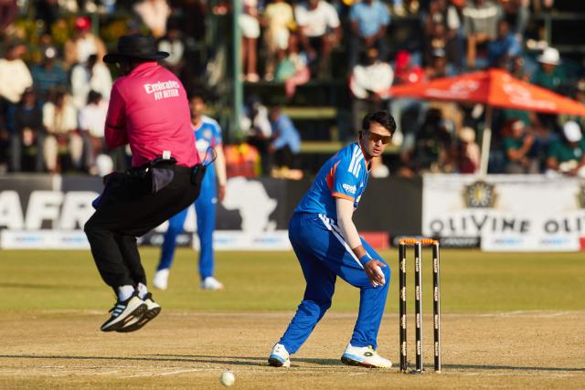 India's Abishek Sharma fields off his own bowling during the second Twenty20 international cricket match between Zimbabwe and India at Harare Sports Club in Harare, on July 25, 2026. (Photo by Jekesai NJIKIZANA / AFP)