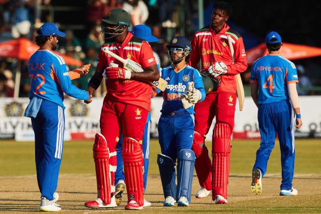 Indian players shake hands with Zimbabwean players after their victory during the second Twenty20 international cricket match between Zimbabwe and India at Harare Sports Club in Harare, on July 25, 2026. (Photo by Jekesai NJIKIZANA / AFP)