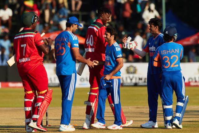 Indian players shake hands with Zimbabwean players after their victory during the second Twenty20 international cricket match between Zimbabwe and India at Harare Sports Club in Harare, on July 25, 2026. (Photo by Jekesai NJIKIZANA / AFP)