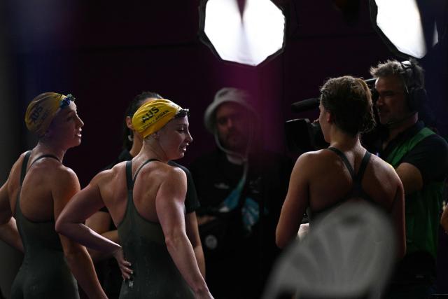Australia's Mollie O'Callaghan is interviewed after winning the Women's 200m Freestyle Final during the swimming event at the Tollcross International Swimming Centre in Glasgow, on day two of the Commonwealth Games in Glasgow, Scotland, on July 25, 2026. (Photo by Oli SCARFF / AFP)