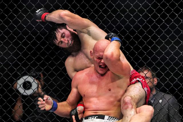 Russia's Magomed Ankalaev and Uzbekistan's Bogdan Guskov compete in their men's light heavyweight fight in the UFC Fight Night event at Etihad Arena in Abu Dhabi on July 25, 2026. (Photo by Fadel SENNA / AFP)