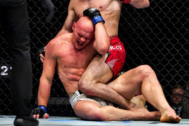 Russia's Magomed Ankalaev and Uzbekistan's Bogdan Guskov compete in their men's light heavyweight fight in the UFC Fight Night event at Etihad Arena in Abu Dhabi on July 25, 2026. (Photo by Fadel SENNA / AFP)