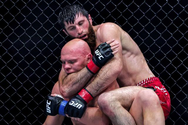 Russia's Magomed Ankalaev and Uzbekistan's Bogdan Guskov compete in their men's light heavyweight fight in the UFC Fight Night event at Etihad Arena in Abu Dhabi on July 25, 2026. (Photo by Fadel SENNA / AFP)