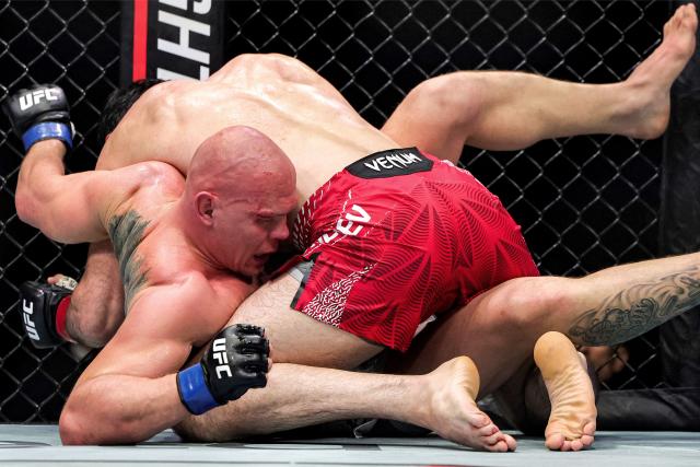 Russia's Magomed Ankalaev and Uzbekistan's Bogdan Guskov compete in their men's light heavyweight fight in the UFC Fight Night event at Etihad Arena in Abu Dhabi on July 25, 2026. (Photo by Fadel SENNA / AFP)