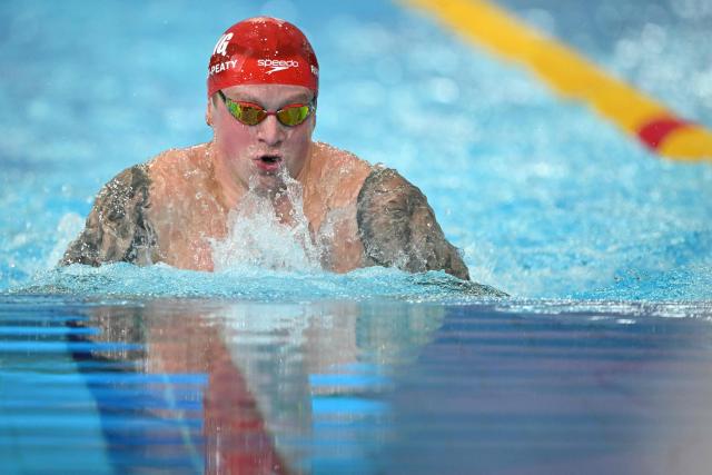 Englands's Adam Ramsay-Peaty competes in the Men's 100m Breaststroke Final during the swimming event at the Tollcross International Swimming Centre in Glasgow, on day two of the Commonwealth Games in Glasgow, Scotland, on July 25, 2026. (Photo by Oli SCARFF / AFP)