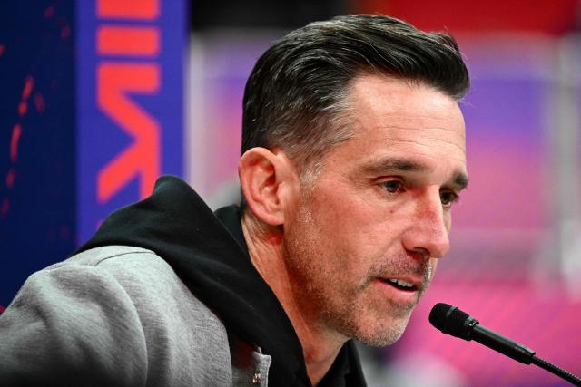 (FILES) San Francisco 49ers head coach Kyle Shanahan speaks to the media during Super Bowl LVIII Opening Night at Allegiant Stadium in Las Vegas, Nevada on February 5, 2024. San Francisco 49ers coach Kyle Shanahan was injured in a car crash and will not lead pre-season training while he recovers, the NFL team said on July 25, 2026. Shanahan is suffering the "lingering effects" of a severe concussion and also broke his nose and multiple ribs in the collision, said general manager John Lynch. (Photo by Patrick T. Fallon / AFP)