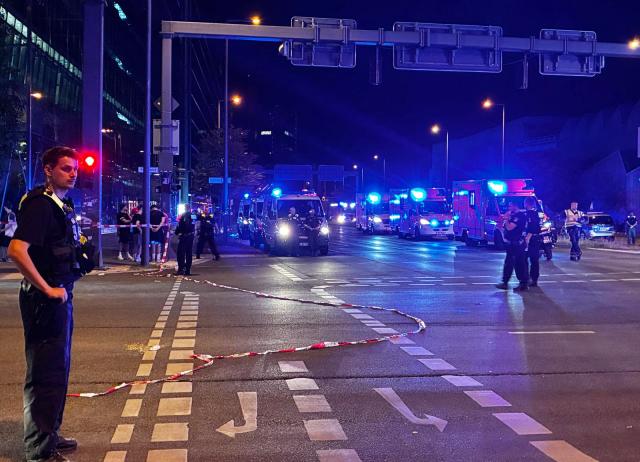 Police work near the scene where one person was killed and around 15 injured after a car is believed to have hit the crowd on the outskirts of the Christopher Street Day (CSD) parade in Berlin, on July 25, 2026. "We believe that a vehicle entered the Tiergarten park and hit several people and injured them," police posted on social media. The injured were being treated by the emergency services and they were actively seeking the people responsible, they added. (Photo by Antoine LAMBROSCHINI / AFP)