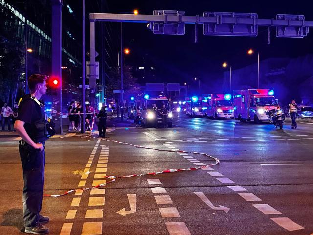 Police work near the scene where one person was killed and around 15 injured after a car is believed to have hit the crowd on the outskirts of the Christopher Street Day (CSD) parade in Berlin, on July 25, 2026. "We believe that a vehicle entered the Tiergarten park and hit several people and injured them," police posted on social media. The injured were being treated by the emergency services and they were actively seeking the people responsible, they added. (Photo by Antoine LAMBROSCHINI / AFP)