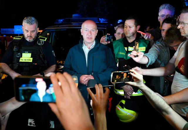 Berlin's mayor Kai Wegner speaks to the media near the scene where one person was killed and around 15 injured after a car is believed to have hit the crowd on the outskirts of the Christopher Street Day (CSD) parade in Berlin, on July 25, 2026. "We believe that a vehicle entered the Tiergarten park and hit several people and injured them," police posted on social media. The injured were being treated by the emergency services and they were actively seeking the people responsible, they added. (Photo by RALF HIRSCHBERGER / AFP)