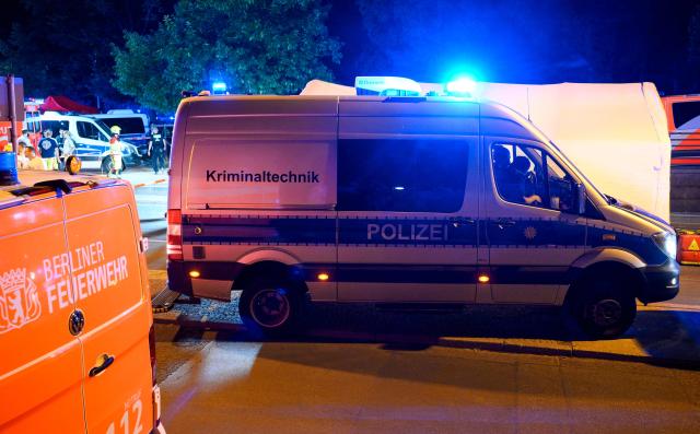 A van of the forensic police stands at the entrance of the Tiergarten tunnel near the scene where one person was killed and around 15 injured after a car is believed to have hit the crowd on the outskirts of the Christopher Street Day (CSD) parade in Berlin, on July 25, 2026. "We believe that a vehicle entered the Tiergarten park and hit several people and injured them," police posted on social media. The injured were being treated by the emergency services and they were actively seeking the people responsible, they added. (Photo by RALF HIRSCHBERGER / AFP)