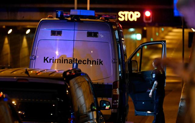 A van of the forensic police stands at the entrance of the Tiergarten tunnel near the scene where one person was killed and around 15 injured after a car is believed to have hit the crowd on the outskirts of the Christopher Street Day (CSD) parade in Berlin, on July 25, 2026. "We believe that a vehicle entered the Tiergarten park and hit several people and injured them," police posted on social media. The injured were being treated by the emergency services and they were actively seeking the people responsible, they added. (Photo by RALF HIRSCHBERGER / AFP)