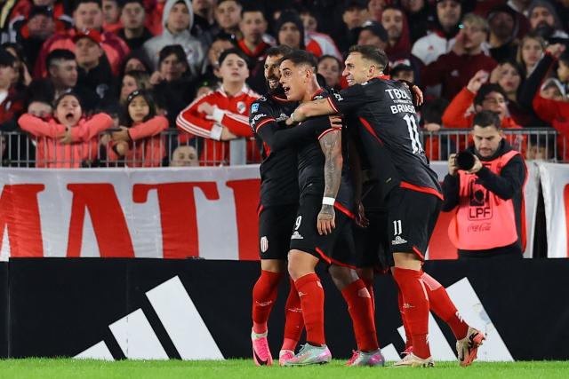 Barracas Central's forward #09 Gonzalo Morales celebrates with teammates after scoring his team's first goal during the Argentine Professional League 2026 Clausura football match between River Plate and Barracas Central at MAS Monumental Stadium in Buenos Aires on July 25, 2026. (Photo by Alejandro PAGNI / AFP)