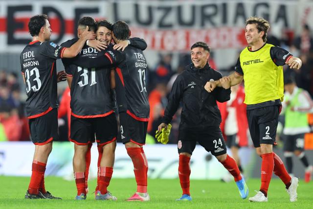 Barracas Central players celebrate after winning the Argentine Professional League 2026 Clausura football match between River Plate and Barracas Central at MAS Monumental Stadium in Buenos Aires on July 25, 2026. (Photo by Alejandro PAGNI / AFP)