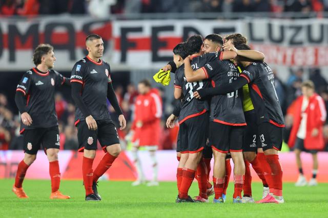 Barracas Central players celebrate after winning the Argentine Professional League 2026 Clausura football match between River Plate and Barracas Central at MAS Monumental Stadium in Buenos Aires on July 25, 2026. (Photo by Alejandro PAGNI / AFP)