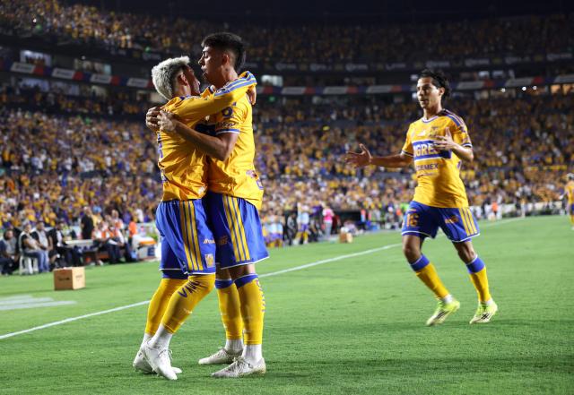 Tigres' Uruguayan midfielder #08 Fernando Gorriaran (L) celebrates with teammate Argentine midfielder #11 Juan Brunetta after scoring the opening goal during the Liga MX Apertura football match between Tigres and San Luis at the Universitario stadium in San Nicolas de los Garza, state of Nuevo Leon, Mexico on July 25, 2026. (Photo by Julio Cesar AGUILAR / AFP)