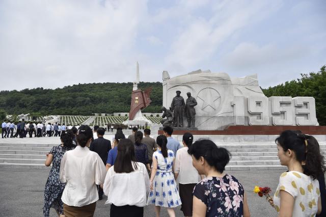 People visit the Fatherland Liberation War Martyrs Cemetery to mark the 73rd anniversary of the end of the Korean War in Pyongyang on July 26, 2026. (Photo by KIM Won Jin / AFP)