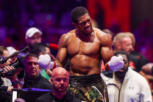 Britain's boxer Anthony Joshua celebrates winning against Albania's boxer Kristian Prenga in their heavyweight boxing fight at the Jeddah Superdome in Jeddah on July 26, 2026. Two-time heavyweight world champion Anthony Joshua survived two early knockdowns on the way to a second-round knockout of Kristian Prenga on July 26, his triumphant ring return paving the way for a blockbuster all-British bout with Tyson Fury. (Photo by AFP)