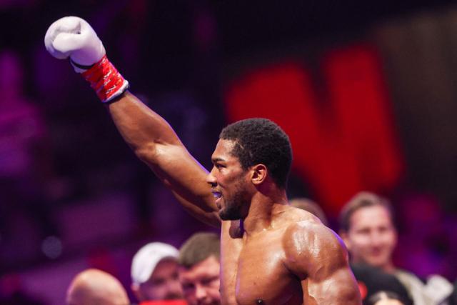 Britain's boxer Anthony Joshua celebrates winning against Albania's boxer Kristian Prenga in their heavyweight boxing fight at the Jeddah Superdome in Jeddah on July 26, 2026. Two-time heavyweight world champion Anthony Joshua survived two early knockdowns on the way to a second-round knockout of Kristian Prenga on July 26, his triumphant ring return paving the way for a blockbuster all-British bout with Tyson Fury. (Photo by AFP)