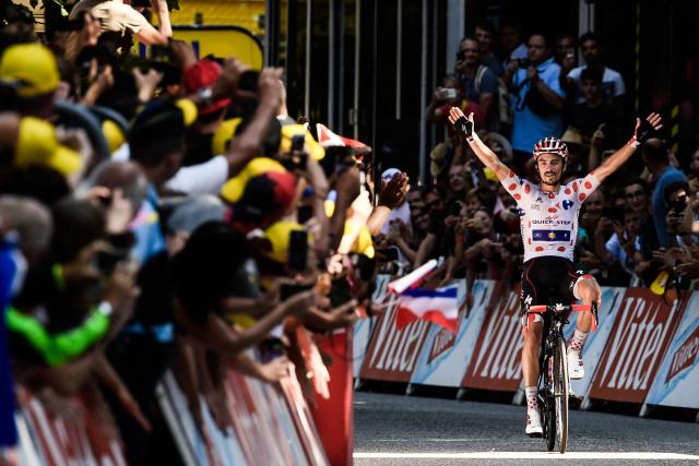 (FILES) France's Julian Alaphilippe, wearing the best climber's polka dot jersey, celebrates as he crosses the finish line to win the 16th stage of the 105th edition of the Tour de France cycling race, between Carcassonne and Bagneres-de-Luchon, southwestern France, on July 24, 2018. “You shouldn’t expect to see me again”: French rider Julian Alaphilippe, double world champion and multiple-time wearer of the yellow jersey in the Tour de France, said on July 25, 2026, that he is unlikely to return to the race after the penultimate stage of this 113th edition. (Photo by Philippe LOPEZ / AFP)