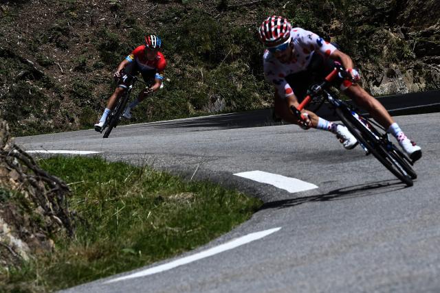 (FILES) Luxembourg's Bob Jungels (L) and France's Julian Alaphilippe descend with a 12-men breakaway group the Col d'Aspin pass during the 19th stage of the 105th edition of the Tour de France cycling race, on July 27, 2018 between Lourdes and Laruns, southwestern France. “You shouldn’t expect to see me again”: French rider Julian Alaphilippe, double world champion and multiple-time wearer of the yellow jersey in the Tour de France, said on July 25, 2026, that he is unlikely to return to the race after the penultimate stage of this 113th edition. (Photo by Jeff PACHOUD / AFP)