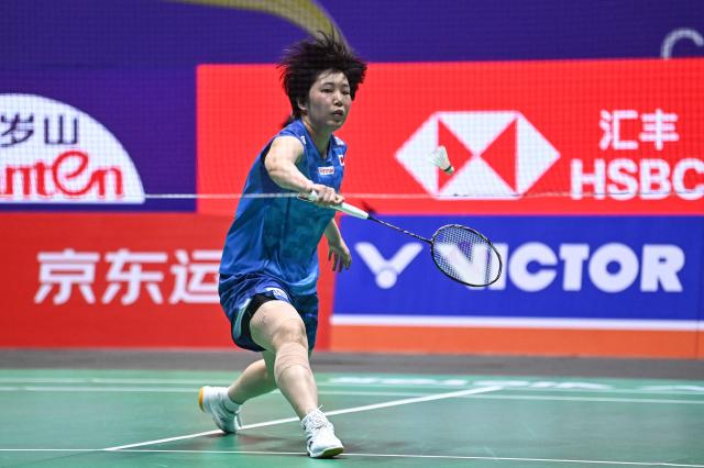 Japan's Akane Yamaguchi hits a return to China's Chen Yufei during their women's singles final match at the China Open badminton tournament in Changzhou, eastern China's Jiangsu province on July 26, 2026. (Photo by CN-STR / AFP) / China OUT
