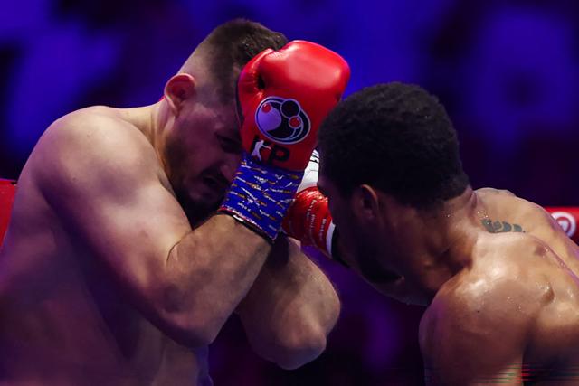 Britain's Anthony Joshua (R) and Albania's Kristian Prenga trade blows during their heavyweight boxing fight at the Jeddah Superdome in Jeddah on July 26, 2026. Two-time heavyweight world champion Anthony Joshua survived two early knockdowns on the way to a second-round knockout of Kristian Prenga on July 26, his triumphant ring return paving the way for a blockbuster all-British bout with Tyson Fury. (Photo by AFP)